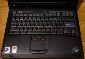 Image of the R51’s keyboard/trackpad area, lid is open.