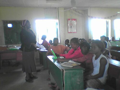 Asabe addresses students during their vacation on the Out Stories activity.