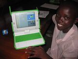 Kagugu Primary School student Christian shows off his work